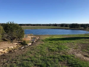 Land clearing for pond construction on a Texas property