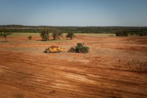 Professional land clearing equipment on Texas land by Shepco Development